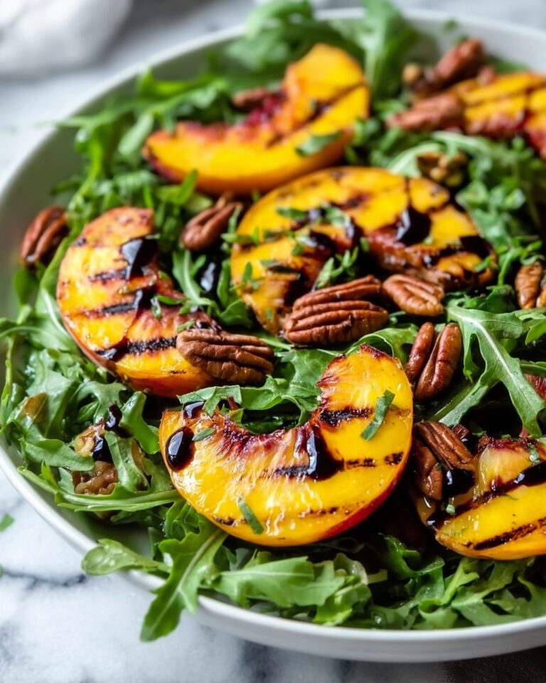 Grilled Peach Salad with Honey Vinaigrette, Candied Curry Pecans, and Arugula Recipe